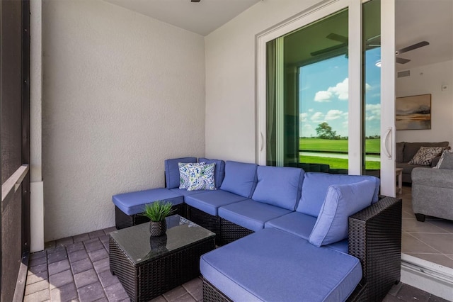 12550 Galapagos Ct Unit 104, Venice, FL 34293 - view of patio / terrace with outdoor lounge area and a ceiling fan