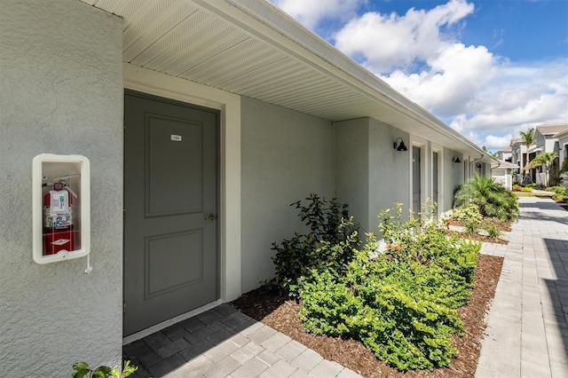 12550 Galapagos Ct Unit 104, Venice, FL 34293 - property entrance with stucco siding