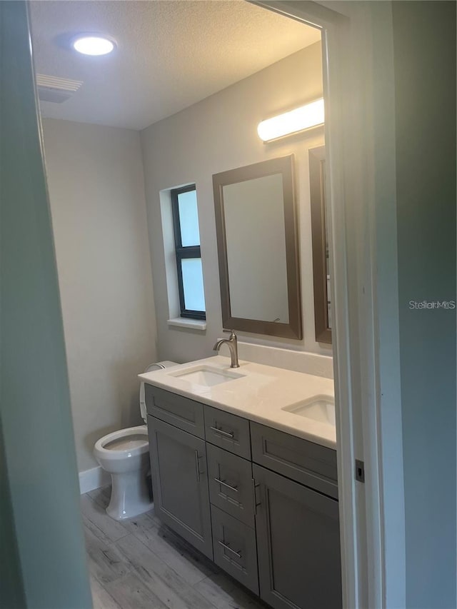 329 Overbrook St, Port Charlotte, FL 33954 - bathroom featuring double vanity and wood finished floors