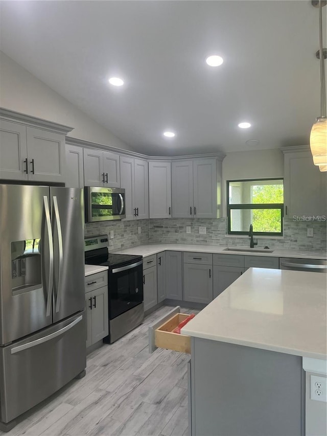 329 Overbrook St, Port Charlotte, FL 33954 - kitchen with stainless steel appliances, gray cabinets, light countertops, decorative backsplash, and lofted ceiling
