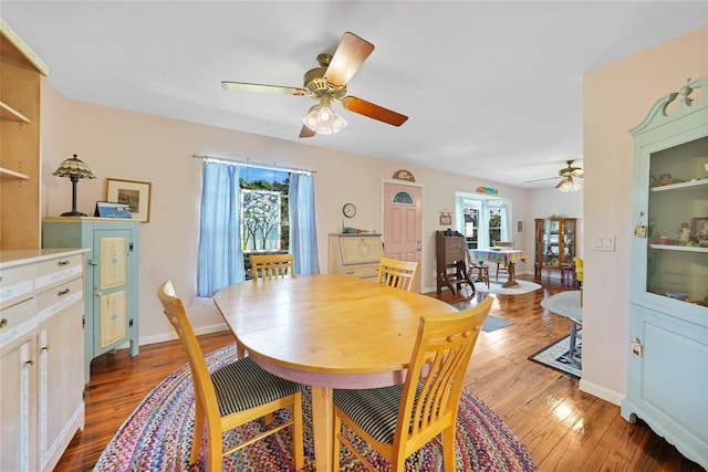 7690 Castleberry Ter, Englewood, FL 34224 - dining room featuring a ceiling fan, plenty of natural light, and wood-type flooring