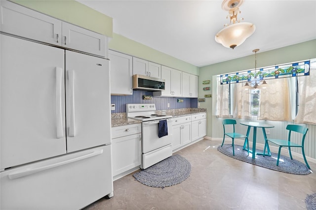 7690 Castleberry Ter, Englewood, FL 34224 - kitchen with white appliances, white cabinetry, light stone counters, and decorative light fixtures