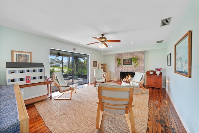 7690 Castleberry Ter, Englewood, FL 34224 - living area with wood finished floors, ceiling fan, a fireplace, and recessed lighting