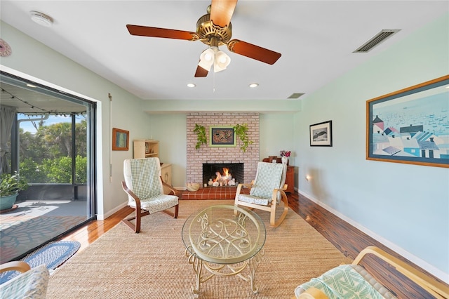 7690 Castleberry Ter, Englewood, FL 34224 - sitting room with wood finished floors, a ceiling fan, a fireplace, and recessed lighting