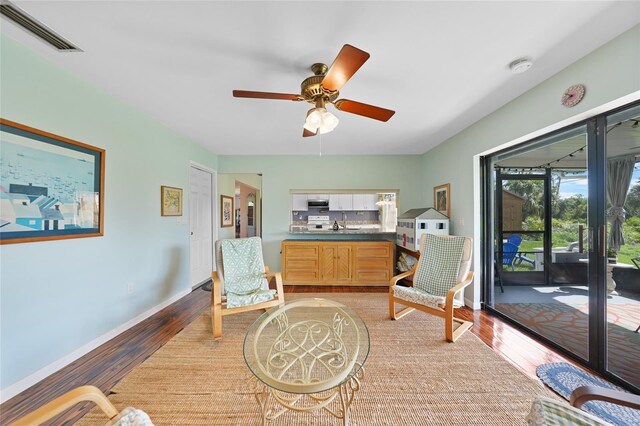 7690 Castleberry Ter, Englewood, FL 34224 - sitting room with a ceiling fan and light wood-style floors
