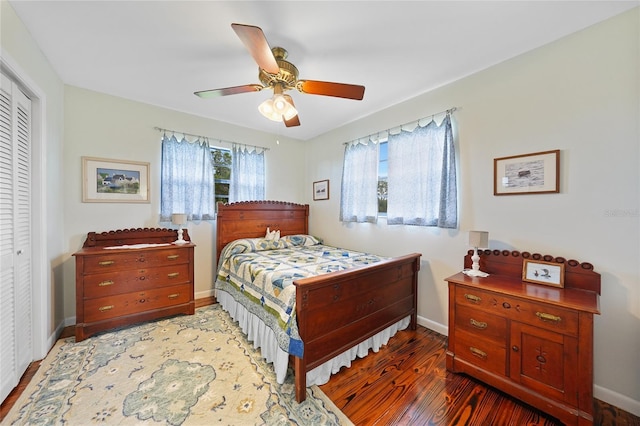 7690 Castleberry Ter, Englewood, FL 34224 - bedroom with a closet, wood finished floors, and a ceiling fan