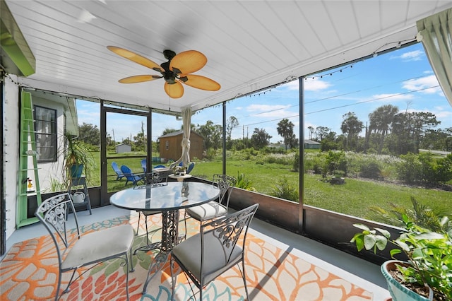 7690 Castleberry Ter, Englewood, FL 34224 - sunroom with outdoor dining area and a ceiling fan