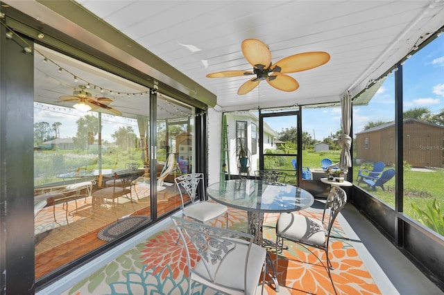 7690 Castleberry Ter, Englewood, FL 34224 - sunroom with ceiling fan, plenty of natural light, and outdoor dining space