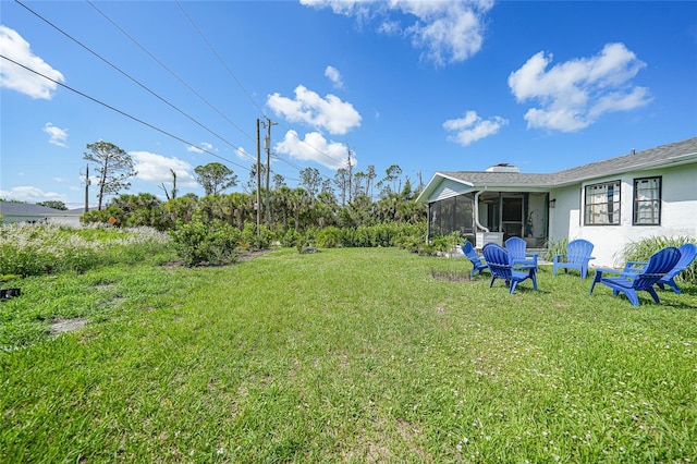 7690 Castleberry Ter, Englewood, FL 34224 - view of green lawn featuring a sunroom