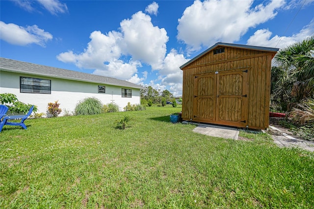 7690 Castleberry Ter, Englewood, FL 34224 - view of green lawn featuring a storage shed