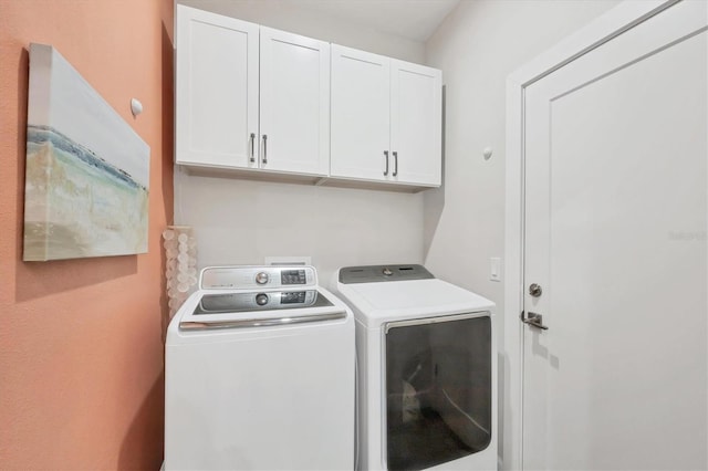 1269 N Lavina St, North Port, FL 34286 - washroom with cabinet space and washing machine and clothes dryer