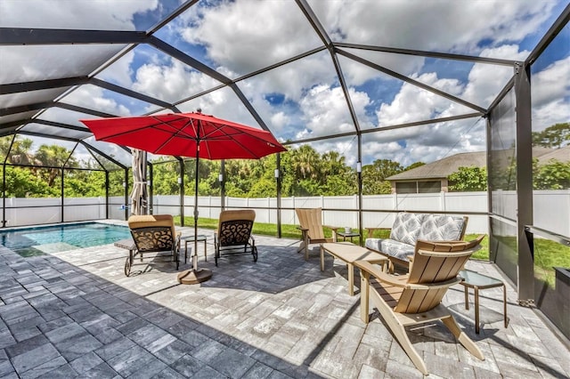 1269 N Lavina St, North Port, FL 34286 - fenced backyard with an outdoor hangout area, a patio, and a lanai