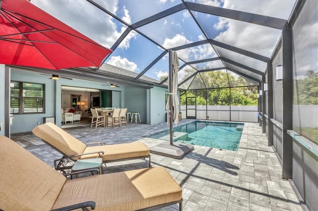 1269 N Lavina St, North Port, FL 34286 - view of pool featuring a patio, ceiling fan, a lanai, and outdoor dining area