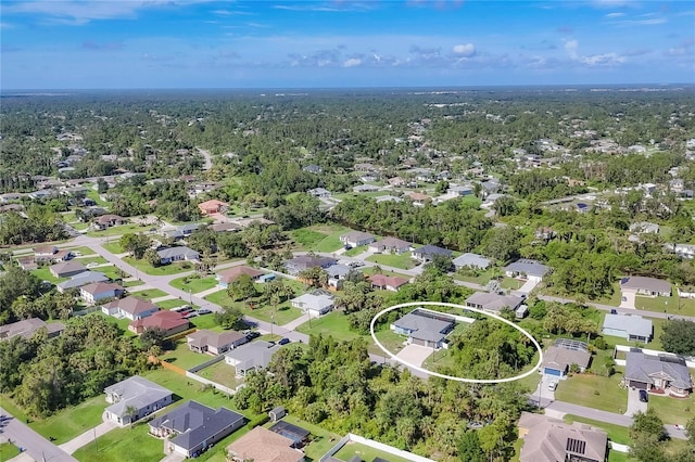1269 N Lavina St, North Port, FL 34286 - aerial view of property and surrounding area featuring nearby suburban area