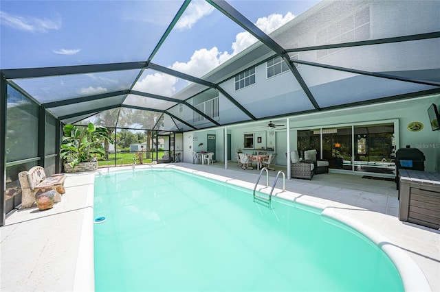 196 Lecturn St, Port Charlotte, FL 33954 - outdoor pool featuring a patio, a lanai, a ceiling fan, and a grill