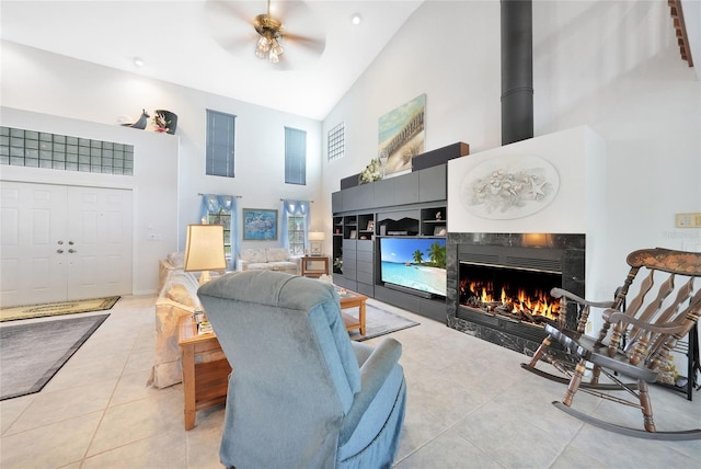 196 Lecturn St, Port Charlotte, FL 33954 - tiled living area with high vaulted ceiling, a ceiling fan, and a fireplace