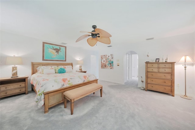 196 Lecturn St, Port Charlotte, FL 33954 - bedroom with arched walkways, light colored carpet, and a ceiling fan