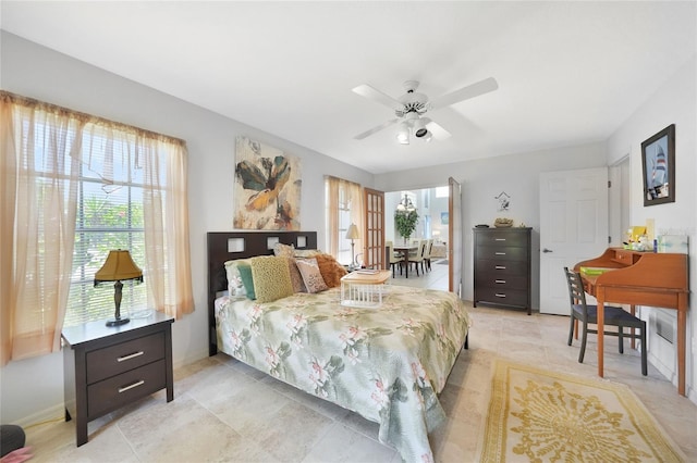 196 Lecturn St, Port Charlotte, FL 33954 - bedroom with light tile patterned floors and a ceiling fan