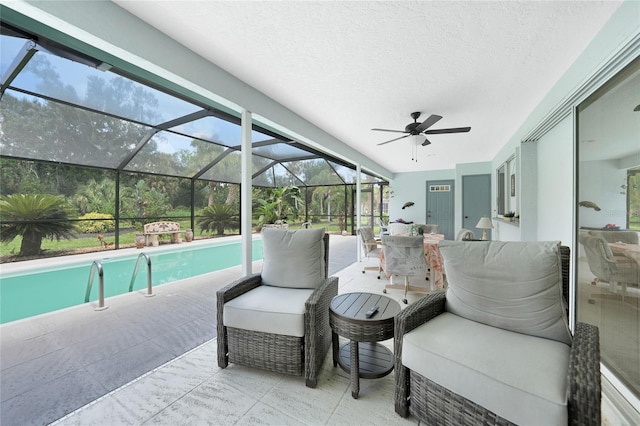 196 Lecturn St, Port Charlotte, FL 33954 - view of patio with an outdoor pool, a ceiling fan, outdoor lounge area, and glass enclosure