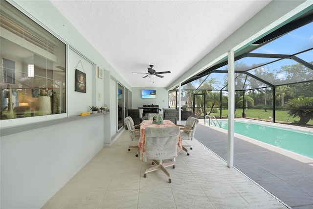 196 Lecturn St, Port Charlotte, FL 33954 - sunroom with area for grilling, a ceiling fan, outdoor dining space, and vaulted ceiling