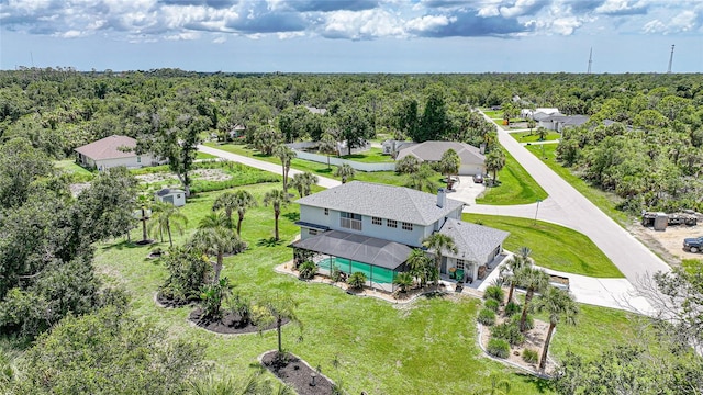 196 Lecturn St, Port Charlotte, FL 33954 - view of subject property featuring a heavily wooded area