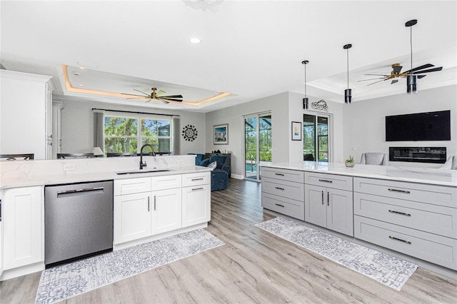 1119 Boundary Blvd, Rotonda West, FL 33947 - kitchen with open floor plan, stainless steel dishwasher, a tray ceiling, a ceiling fan, and recessed lighting