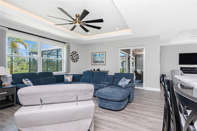 1119 Boundary Blvd, Rotonda West, FL 33947 - living area with a raised ceiling, healthy amount of natural light, light wood-style floors, and recessed lighting