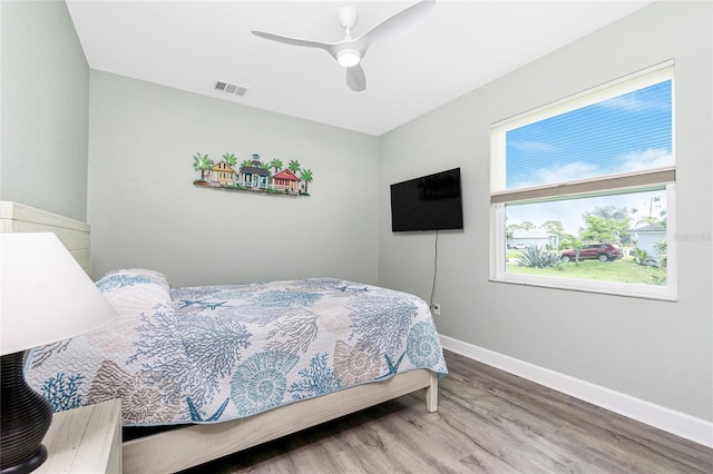 1119 Boundary Blvd, Rotonda West, FL 33947 - bedroom with wood finished floors and ceiling fan