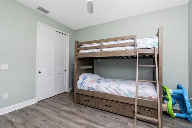 1119 Boundary Blvd, Rotonda West, FL 33947 - bedroom with wood finished floors, ceiling fan, and a closet
