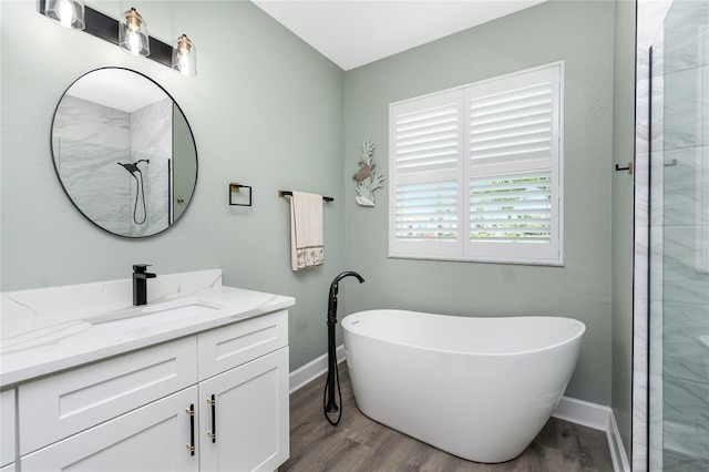 1119 Boundary Blvd, Rotonda West, FL 33947 - bathroom with vanity, a freestanding tub, wood finished floors, and tiled shower