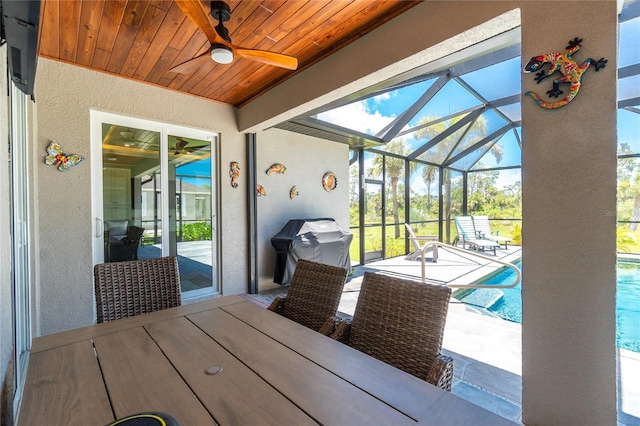 1119 Boundary Blvd, Rotonda West, FL 33947 - sunroom with ceiling fan, plenty of natural light, and outdoor dining space