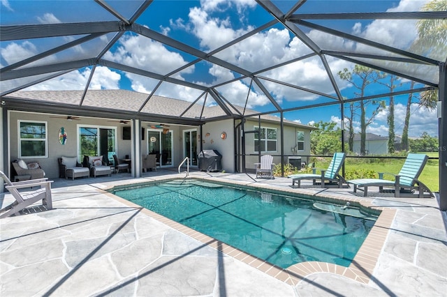 1119 Boundary Blvd, Rotonda West, FL 33947 - swimming pool with ceiling fan, a patio, an outdoor hangout area, a grill, and glass enclosure