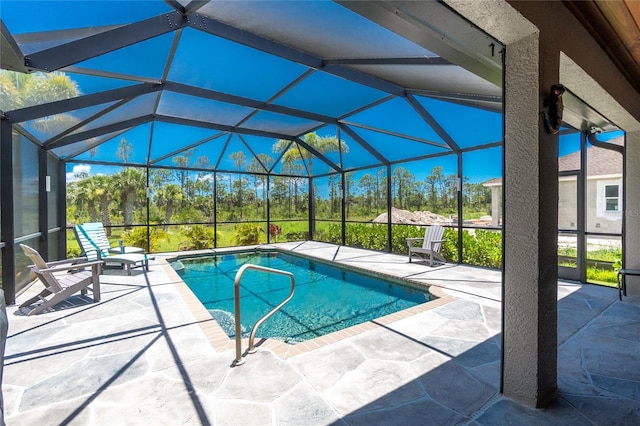 1119 Boundary Blvd, Rotonda West, FL 33947 - outdoor pool featuring a patio, a lanai, and view of scattered trees