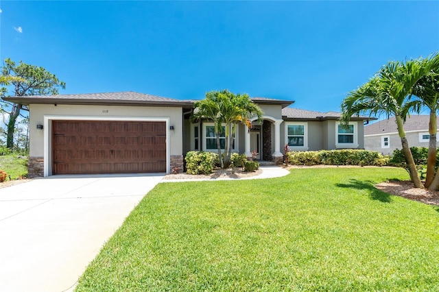 1119 Boundary Blvd, Rotonda West, FL 33947 - view of front of home with a garage, stucco siding, driveway, a front yard, and stone siding