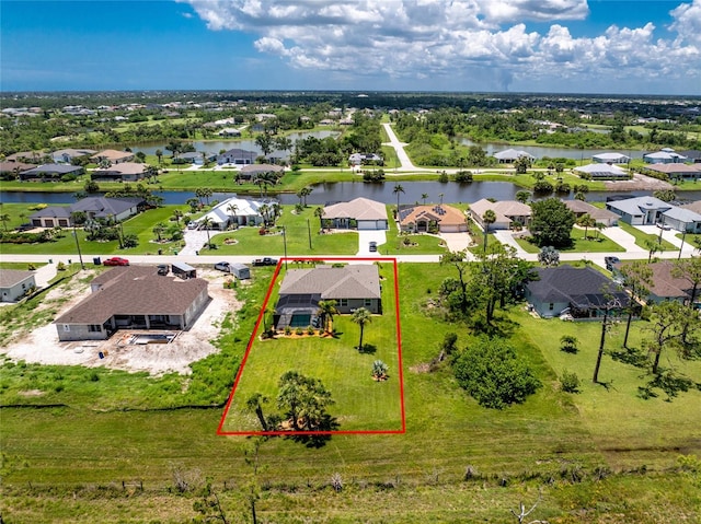 1119 Boundary Blvd, Rotonda West, FL 33947 - aerial view of residential area featuring property boundaries highlighted and a large body of water