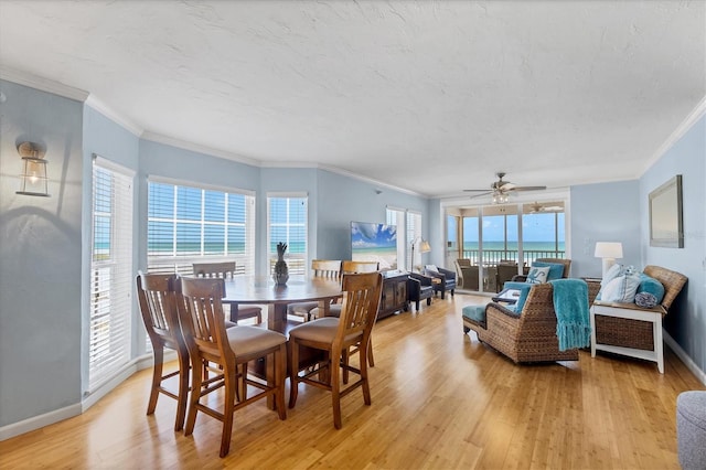 7554 Palm Island Dr S Unit 1813, Placida, FL 33946 - dining area featuring light wood-style flooring, crown molding, and ceiling fan