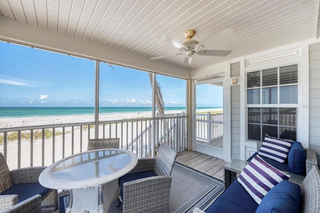 7554 Palm Island Dr S Unit 1813, Placida, FL 33946 - sunroom / solarium with ceiling fan and view of water and beach