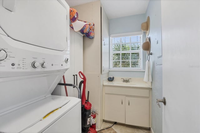 7554 Palm Island Dr S Unit 1813, Placida, FL 33946 - washroom featuring stacked washer and clothes dryer and cabinet space