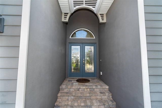 10487 Coquina Ct, Placida, FL 33946 - view of exterior entry featuring french doors
