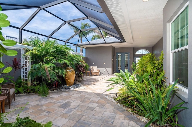 10487 Coquina Ct, Placida, FL 33946 - view of patio featuring french doors and a lanai