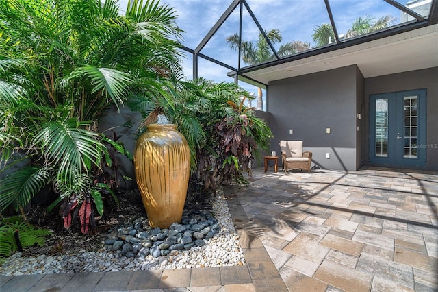 10487 Coquina Ct, Placida, FL 33946 - view of patio featuring french doors and glass enclosure