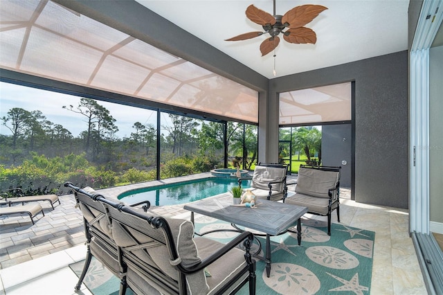 10487 Coquina Ct, Placida, FL 33946 - sunroom / solarium featuring ceiling fan, a swimming pool, and a hot tub