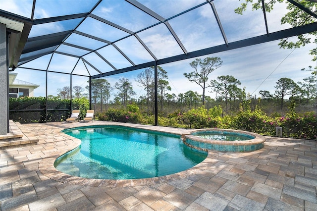 10487 Coquina Ct, Placida, FL 33946 - view of pool featuring a patio, a pool with connected hot tub, and glass enclosure