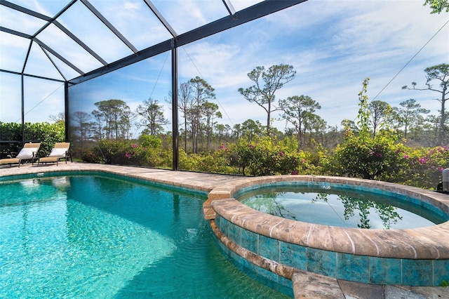 10487 Coquina Ct, Placida, FL 33946 - view of swimming pool with a lanai, a pool with connected hot tub, and a patio area