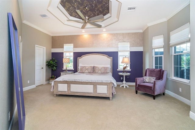 10487 Coquina Ct, Placida, FL 33946 - bedroom featuring multiple windows, light colored carpet, ornamental molding, ceiling fan, and a tray ceiling