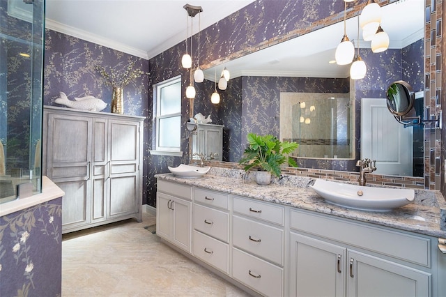 10487 Coquina Ct, Placida, FL 33946 - full bath featuring wallpapered walls, ornamental molding, a shower with shower door, double vanity, and marble finish flooring