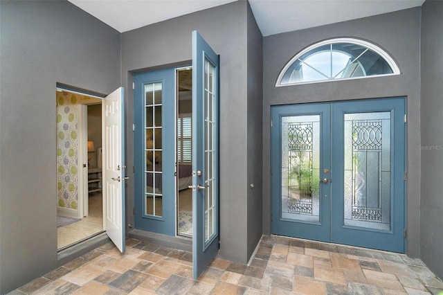 10487 Coquina Ct, Placida, FL 33946 - view of exterior entry featuring french doors and stucco siding