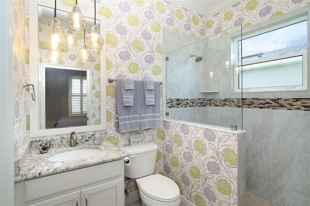 10487 Coquina Ct, Placida, FL 33946 - bathroom with wallpapered walls, vanity, walk in shower, a chandelier, and crown molding