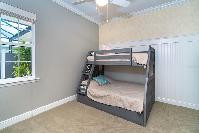 10487 Coquina Ct, Placida, FL 33946 - carpeted bedroom with crown molding and ceiling fan
