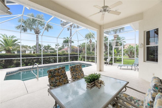 117 Abercrombie Ave, Englewood, FL 34223 - outdoor pool featuring a patio, ceiling fan, outdoor dining space, and glass enclosure